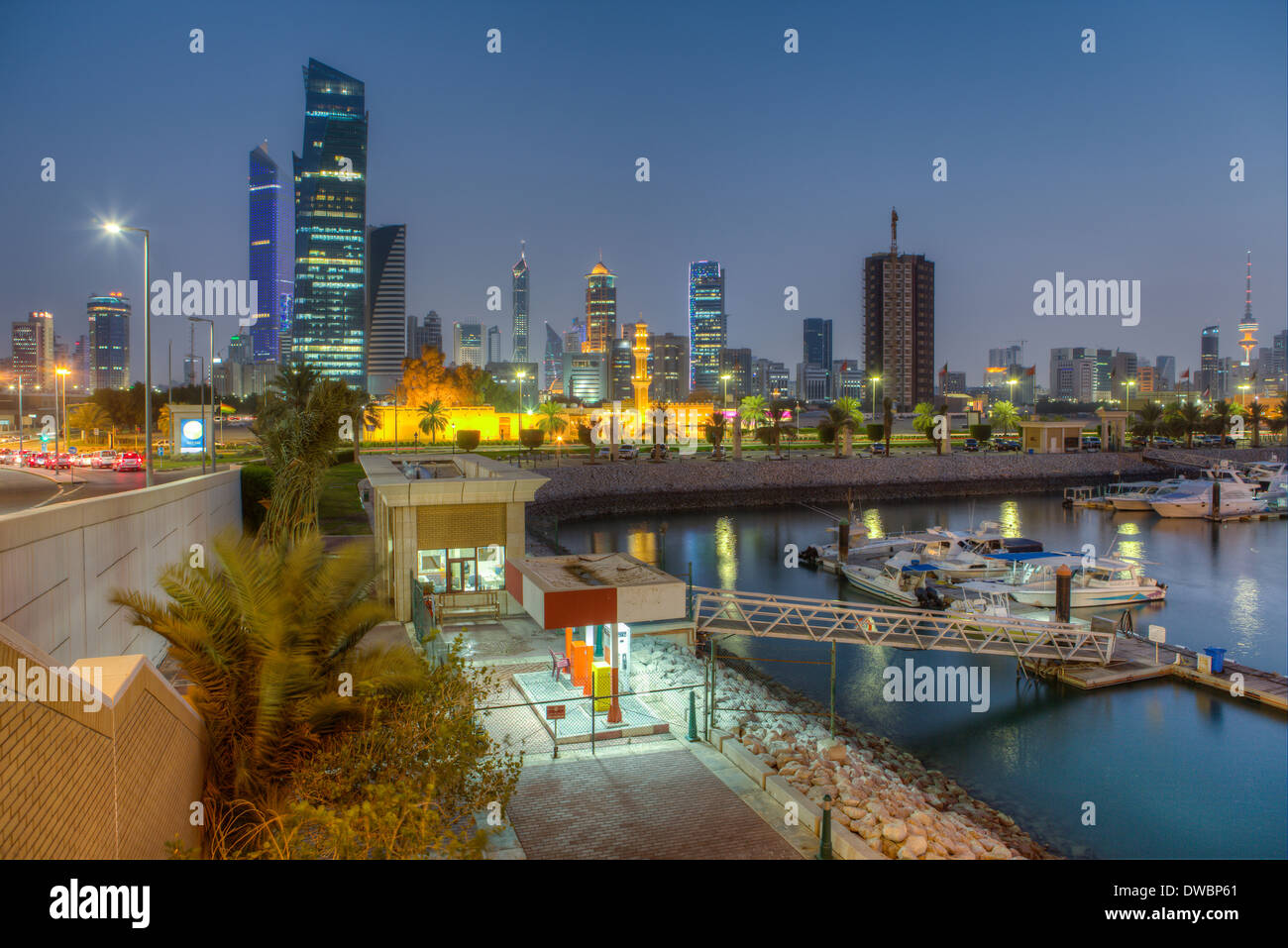 Souk Shark Mall and Kuwait harbour, Kuwait, Arabian Peninsula, illuminated at dusk Stock Photo