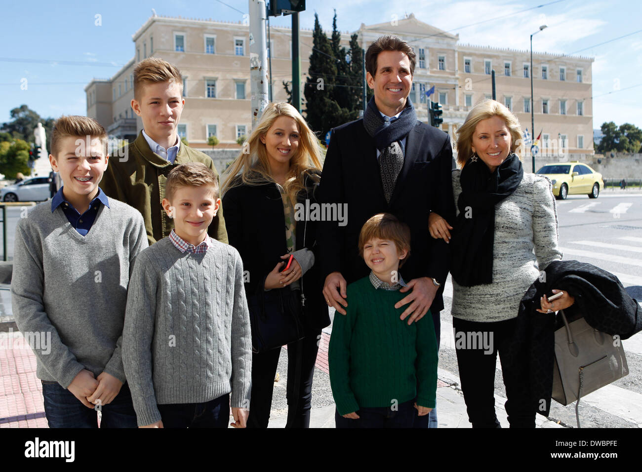 Athens, Greece. 5th Mar, 2014. Prince Pavlos and Marie-Chantel of Greece with their children photographed in the center of Athens with Greek parliament in the background. Greek Royal family arrived in Athens to attend the memorial service for the 50 years since the death of her father, King Paul, to be held Thursday at Tatoi. A day before, on Wednesday afternoon will be held at the auditorium of the Gennadius Library, the official screening of the documentary the ''Paul, an unlikely king'', Greek production, which was made ''‹''‹the occasion of the year, 50 years after the death of King Paul Stock Photo