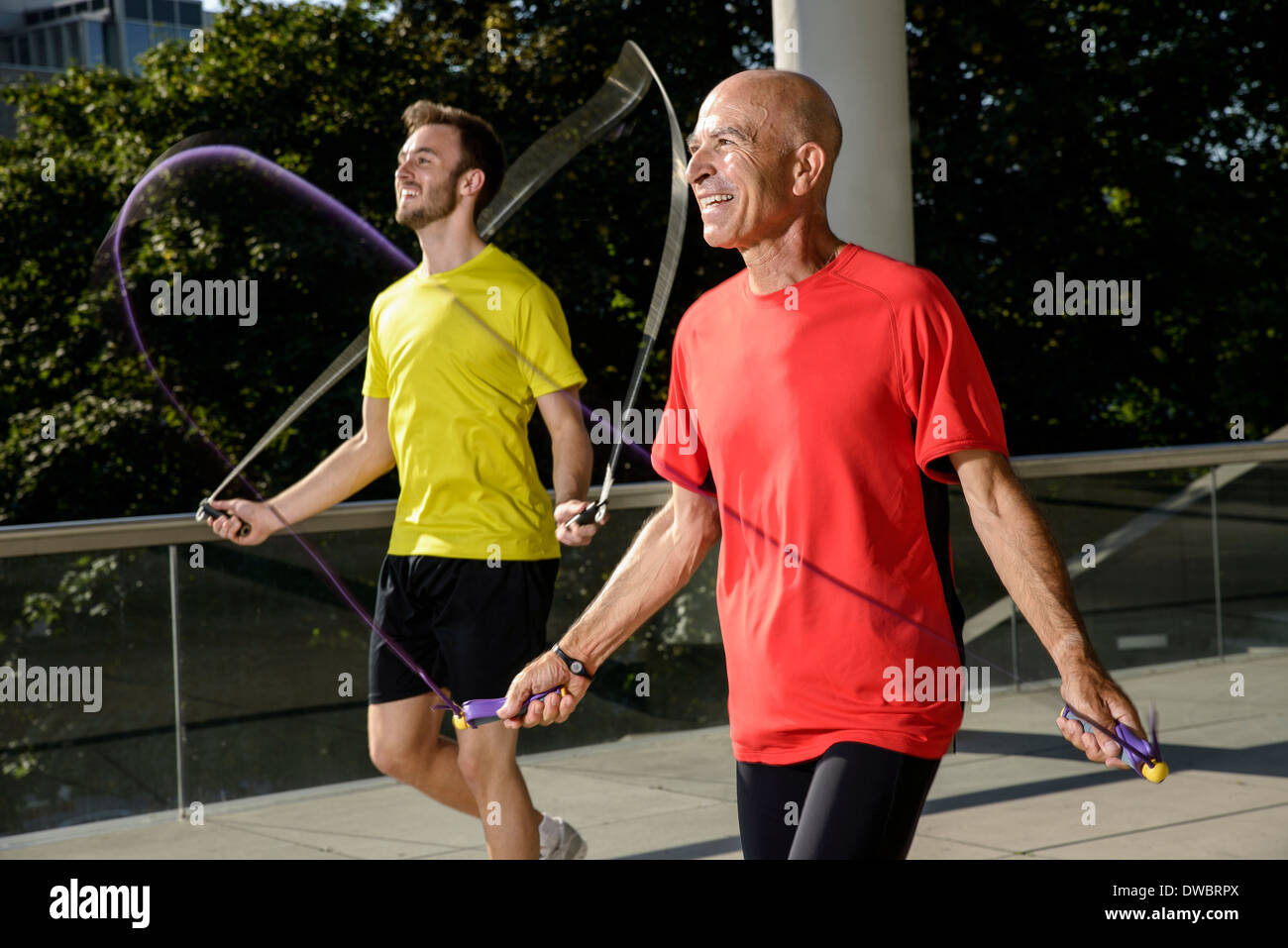 Two male athletes exercising with skipping ropes Stock Photo