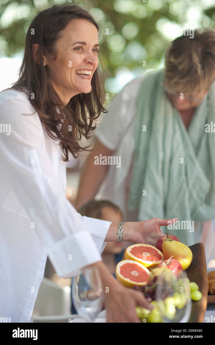 Woman serving platter of fruits Stock Photo Alamy