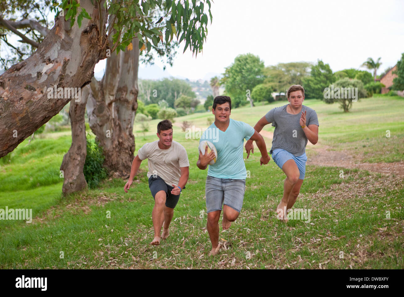 Boys playing touch rugby Stock Photo