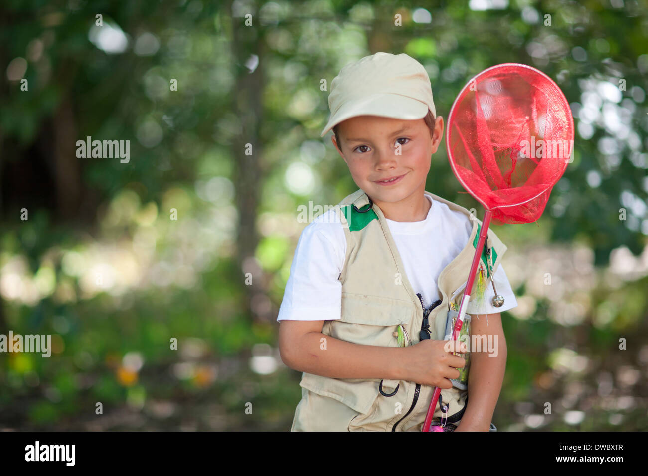 Young boy holding fishing net hi-res stock photography and images - Alamy
