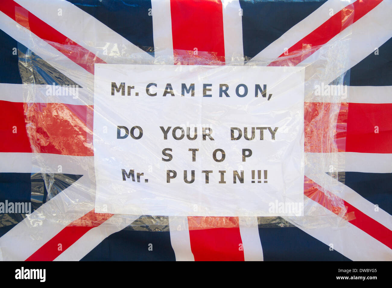 Westminster London ,UK. 5th March 2014. Ukrainian protesters continue to hold a 24hour shift protest outside Downing Street with placards following the Russian military intervention in the Crimea demanding on the British Government to keep its promises on the Budapest memorandum on Security Assurances signed in 1994. Credit:  amer ghazzal/Alamy Live News Stock Photo