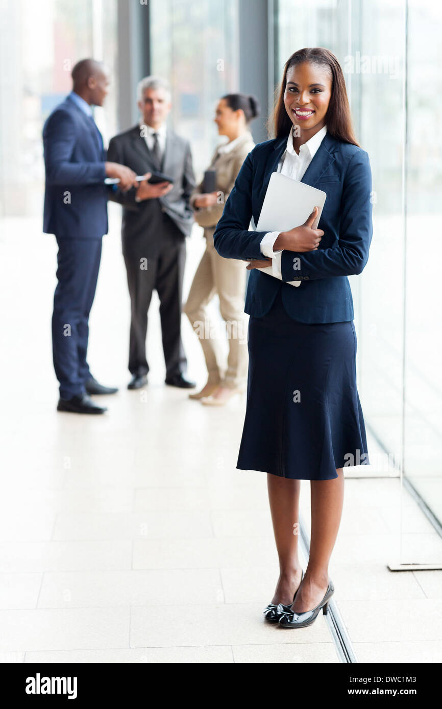 beautiful African businesswoman standing in modern office Stock Photo ...
