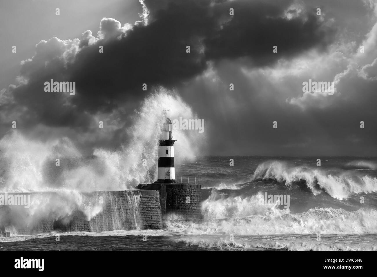 Waves crashing over Seaham Lighthouse - England. Stock Photo