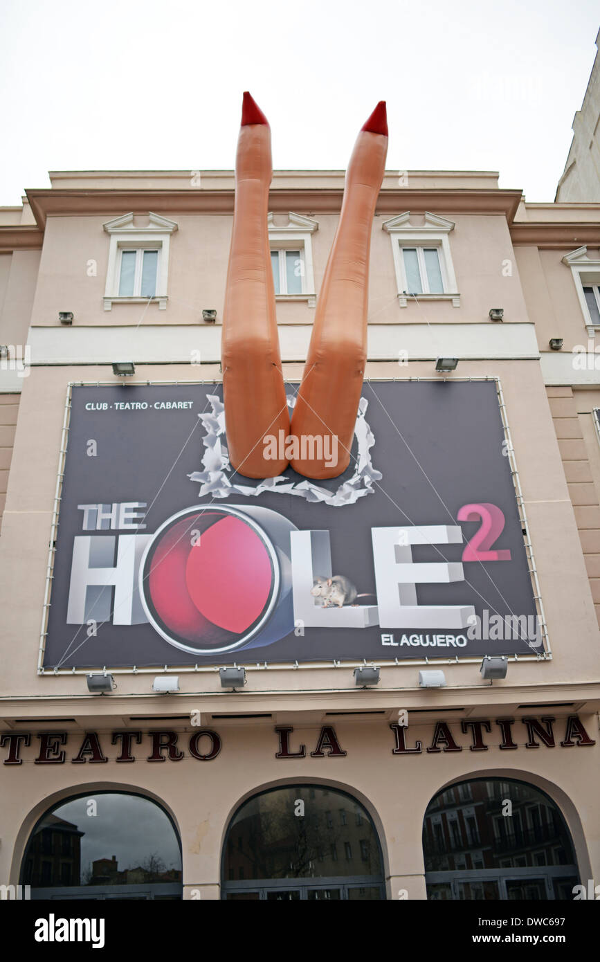 Inflatable legs in banner of The Hole 2, musical show in La Latina, Madrid Stock Photo