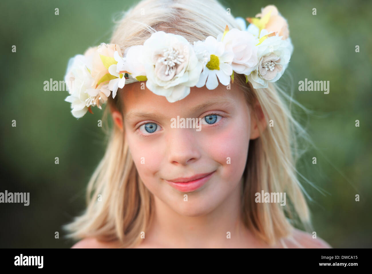 Portrait of girl with flower garland in her hair Stock Photo