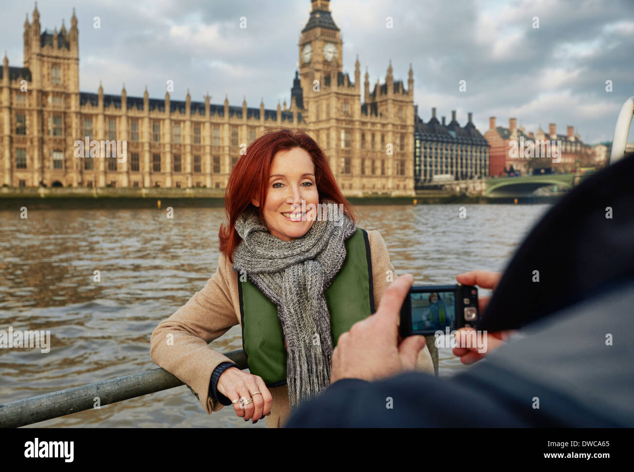 Mature tourist couple photographing Houses of Parliament, London, UK Stock Photo