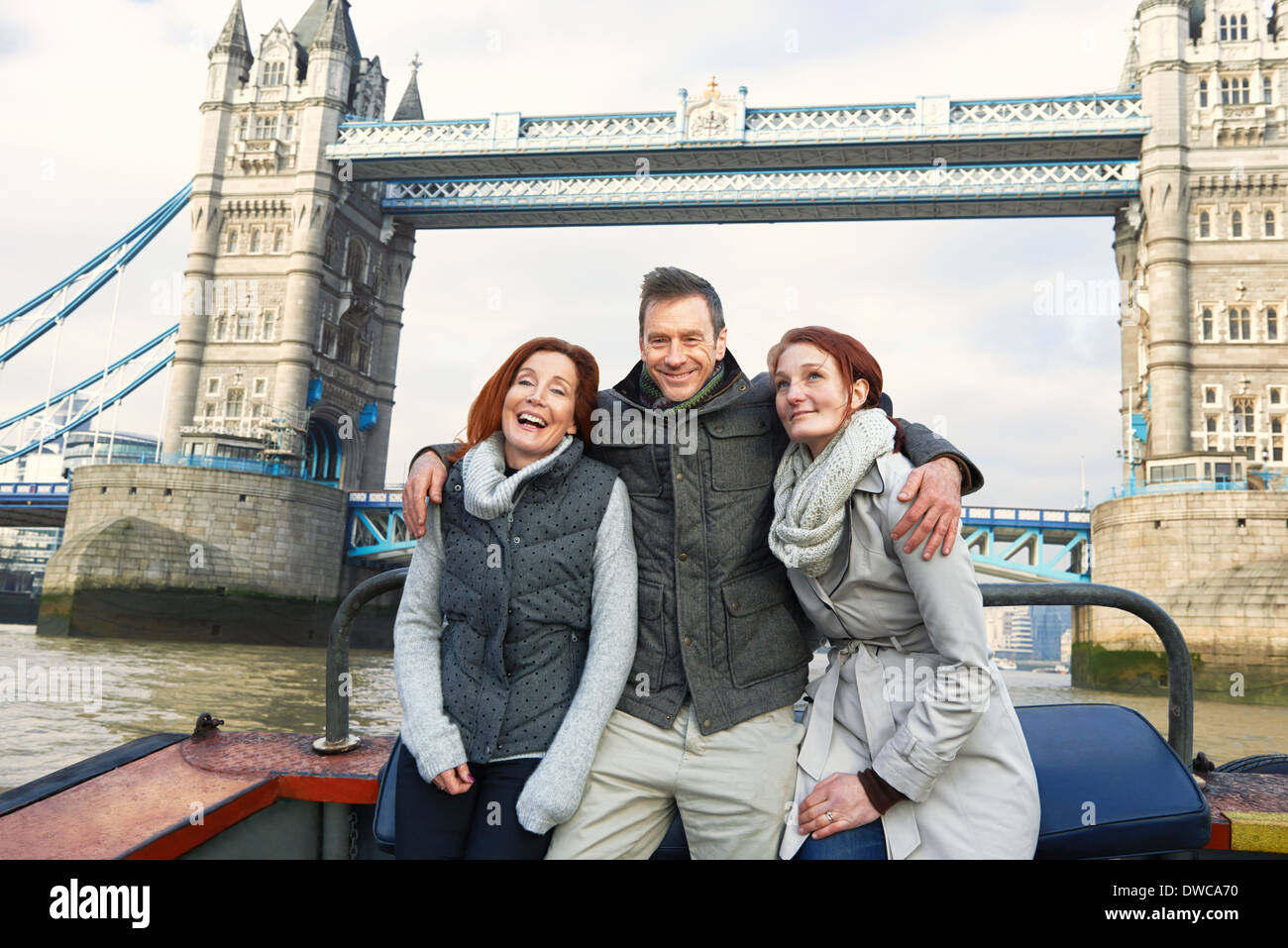 Friends sightseeing on Thames boat, London, UK Stock Photo