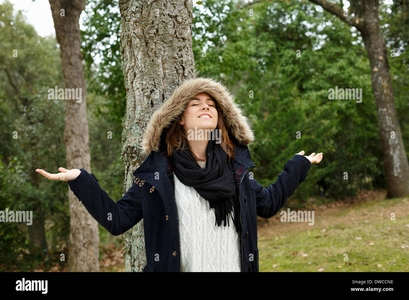 Young woman enjoying air in forest Stock Photo
