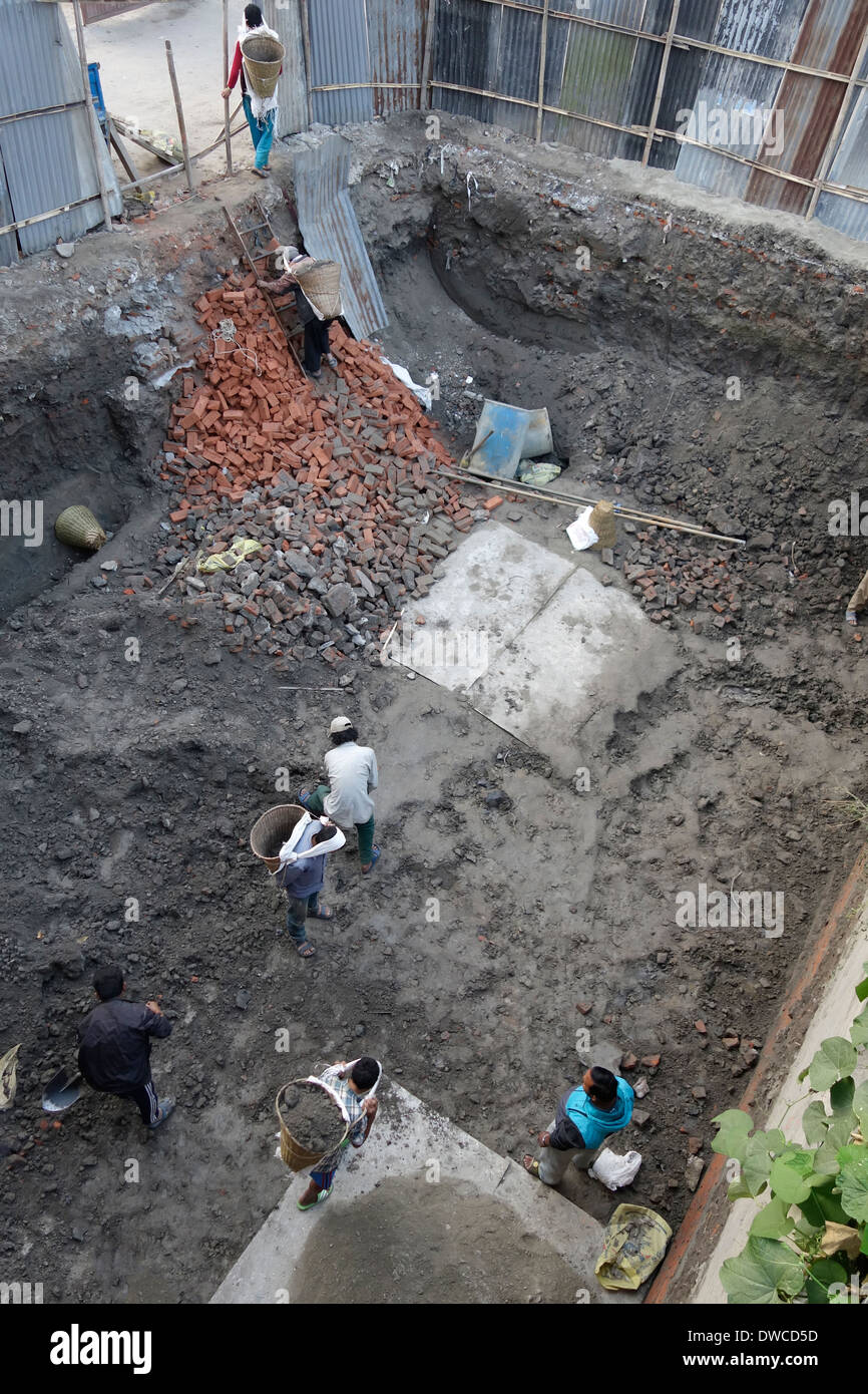 Laborers excavating a construction site by hand in Kathmandu, Nepal. Stock Photo