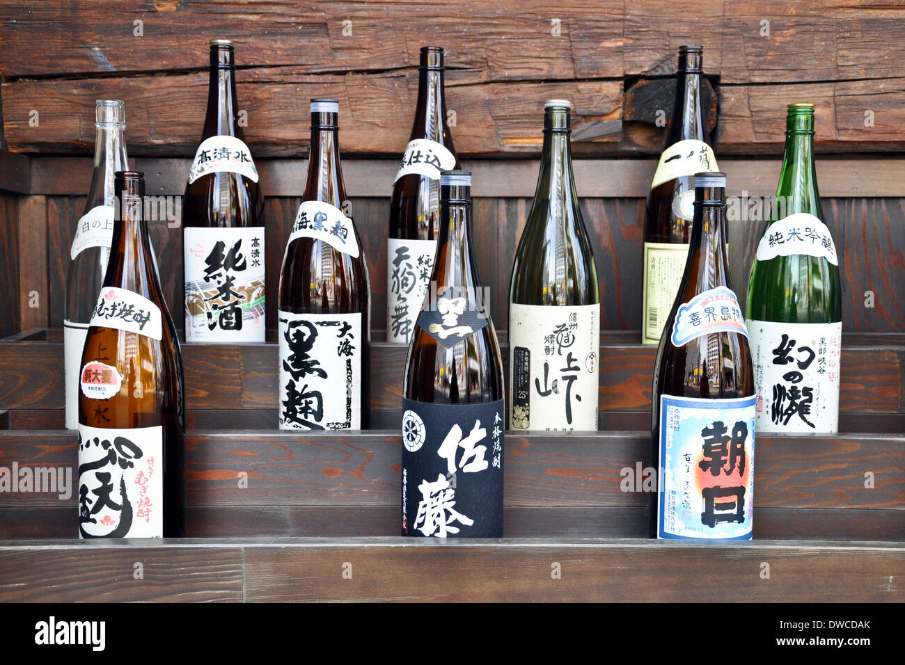 Japanese sake bottles on a shelf Stock Photo