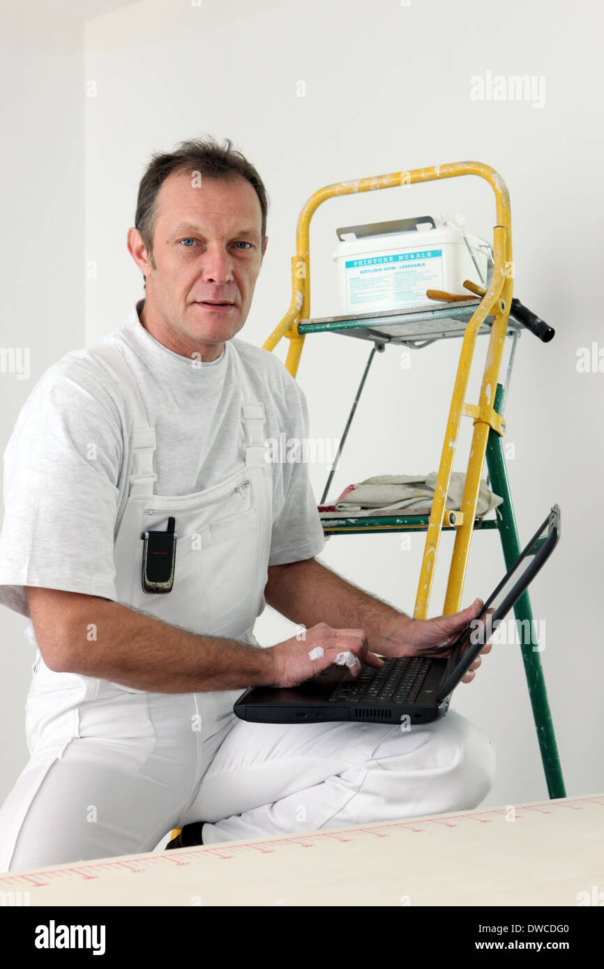 Painter equipped with computer Stock Photo Alamy