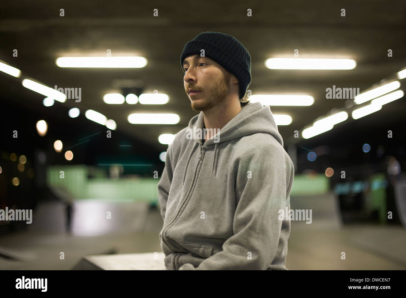 Portrait of young man wearing knit hat and hooded top Stock Photo