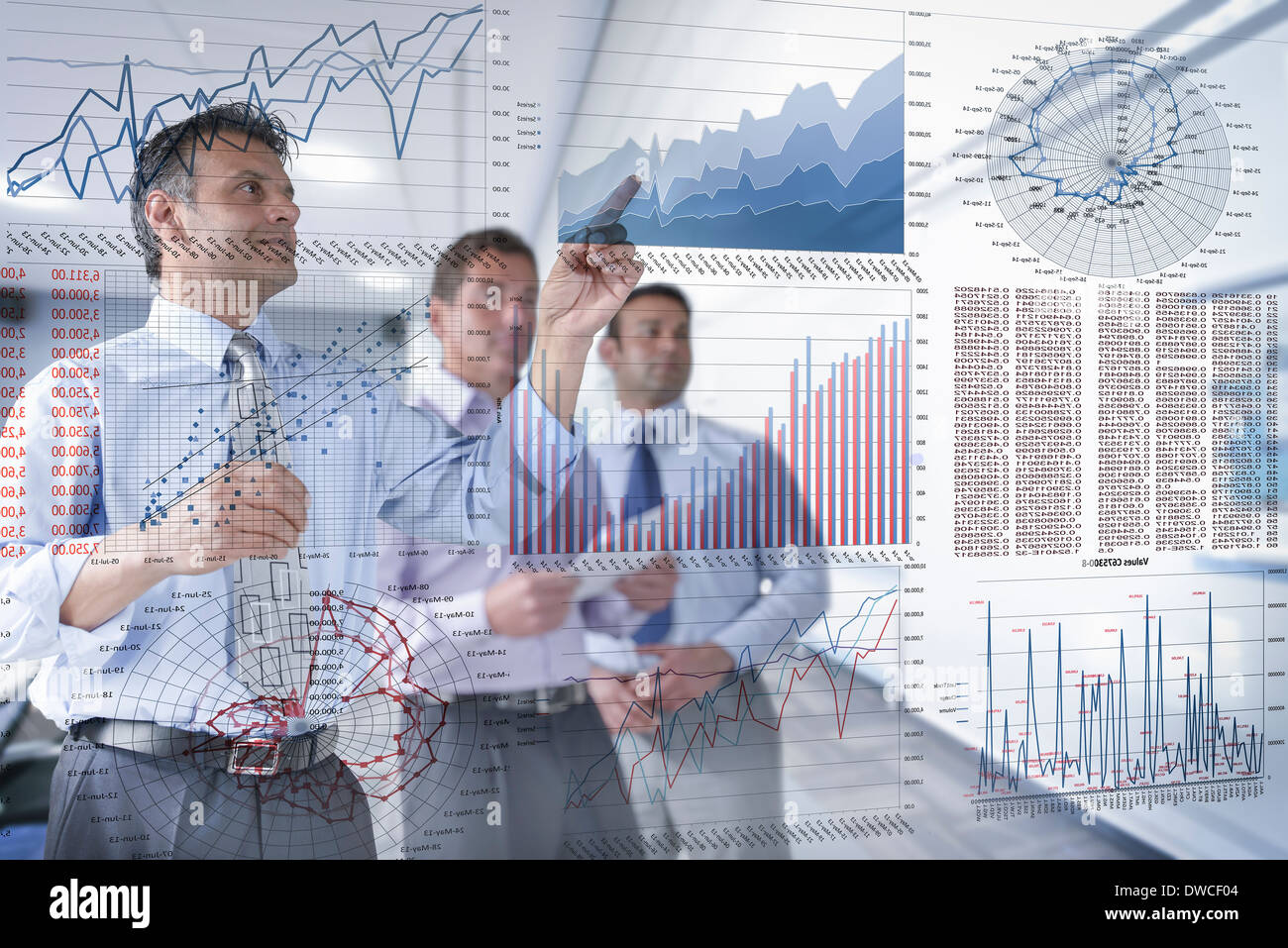 Businessmen discussing graphs and charts seen through screen Stock Photo