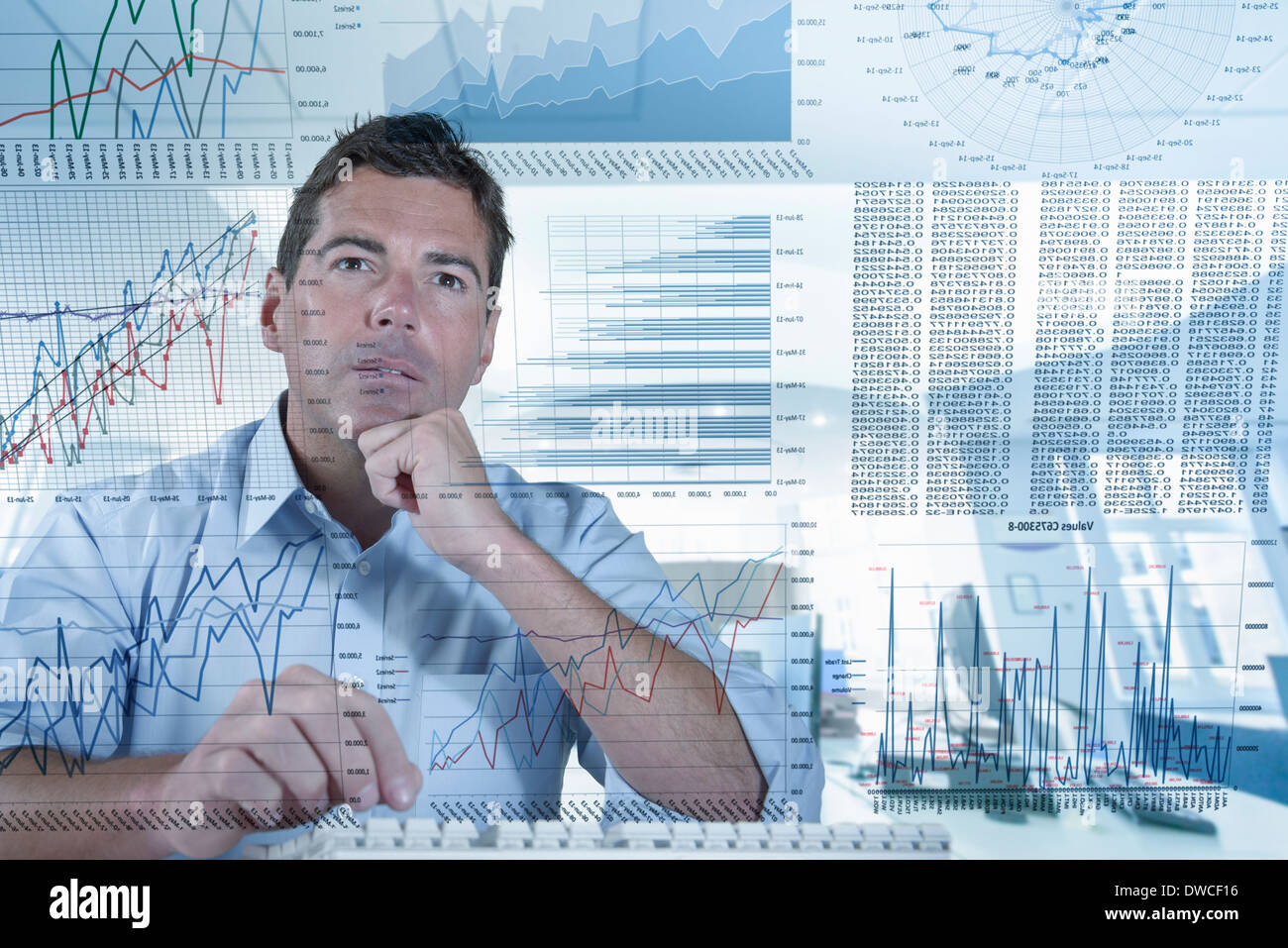 Businessman working with graphs and charts seen through screen Stock Photo