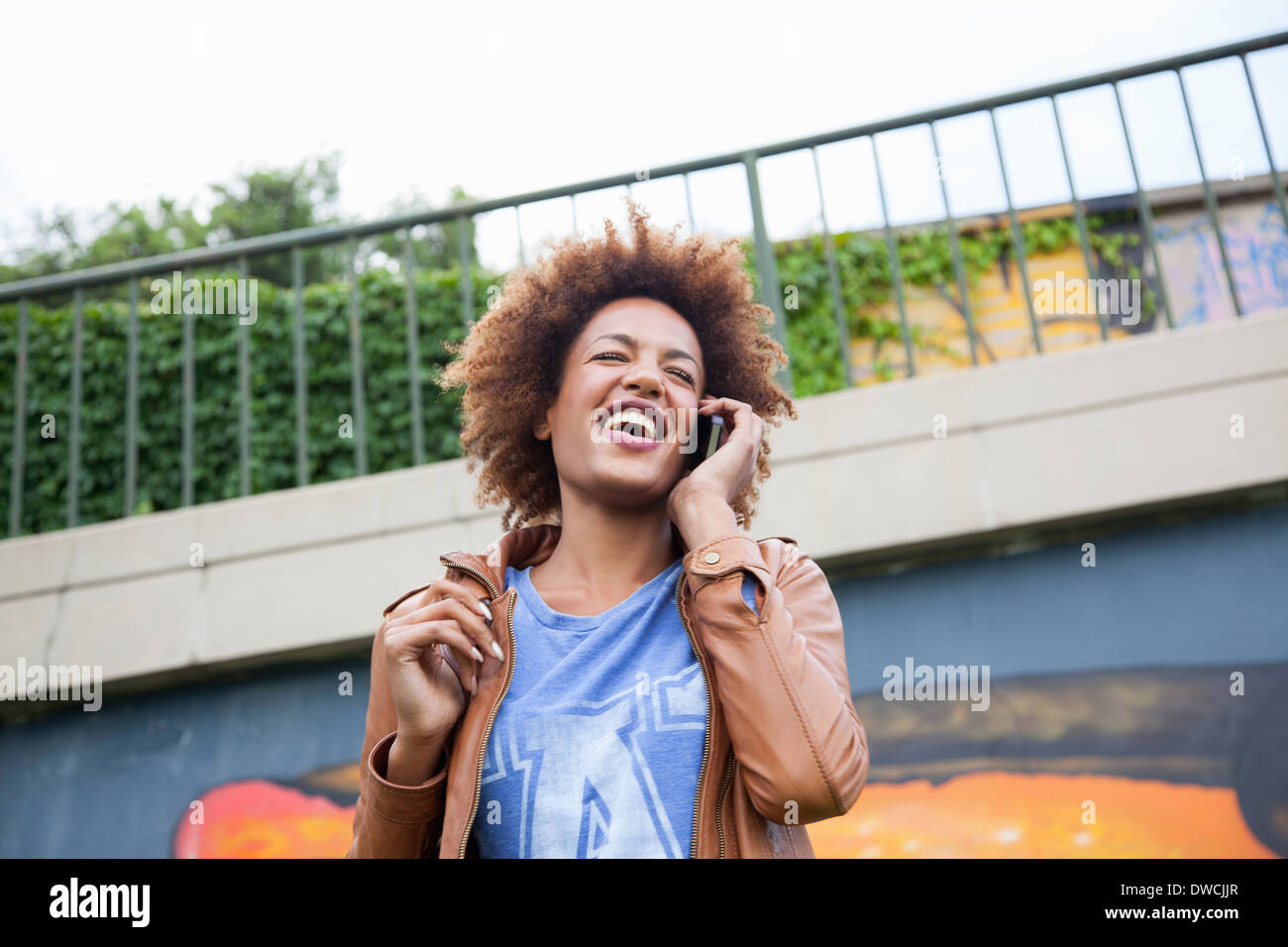 Young woman chatting on smartphone Stock Photo