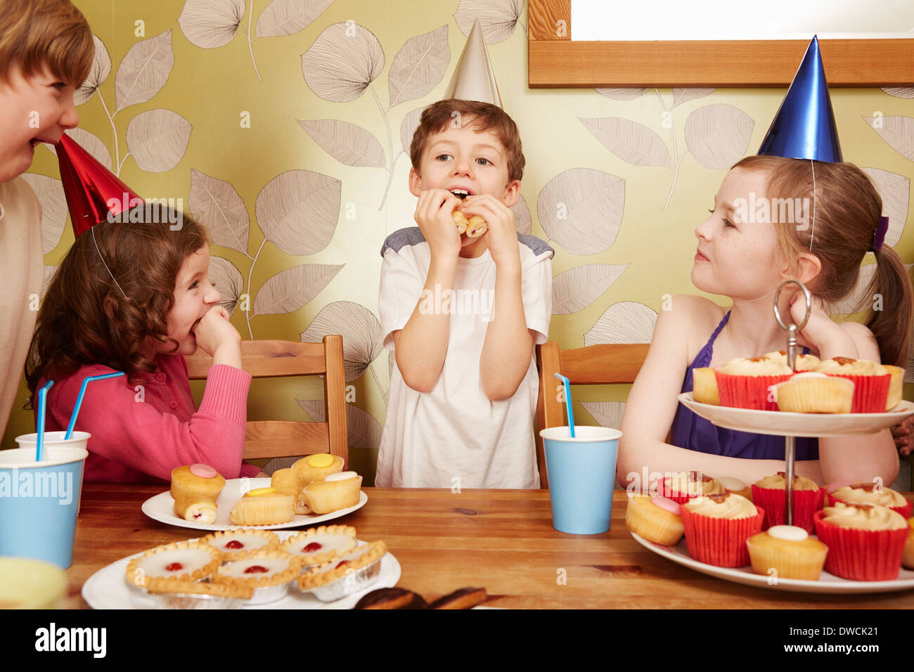 Children eating party food at birthday party Stock Photo - Alamy