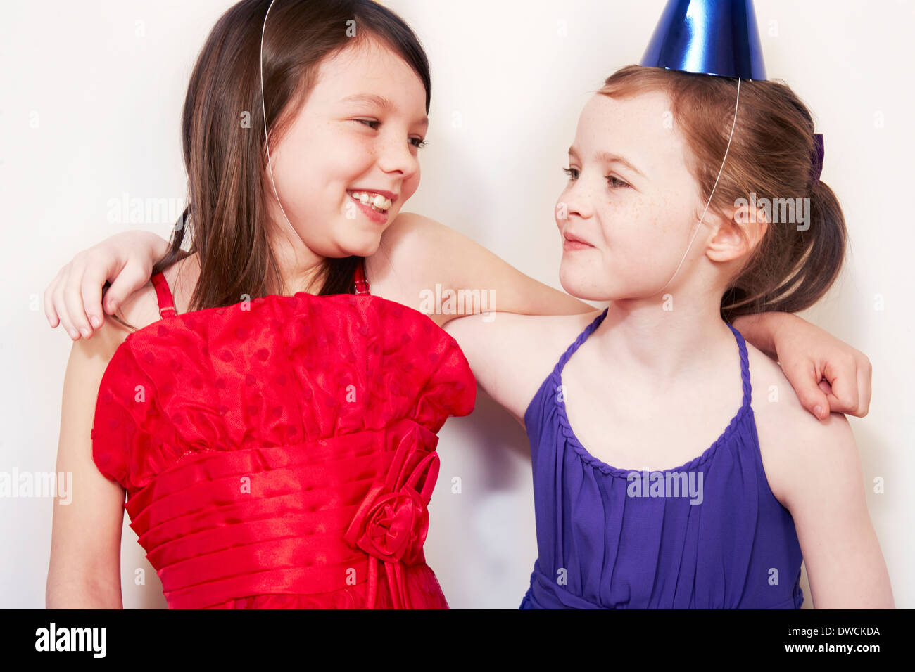 Portrait of two girls with arms around each other Stock Photo - Alamy
