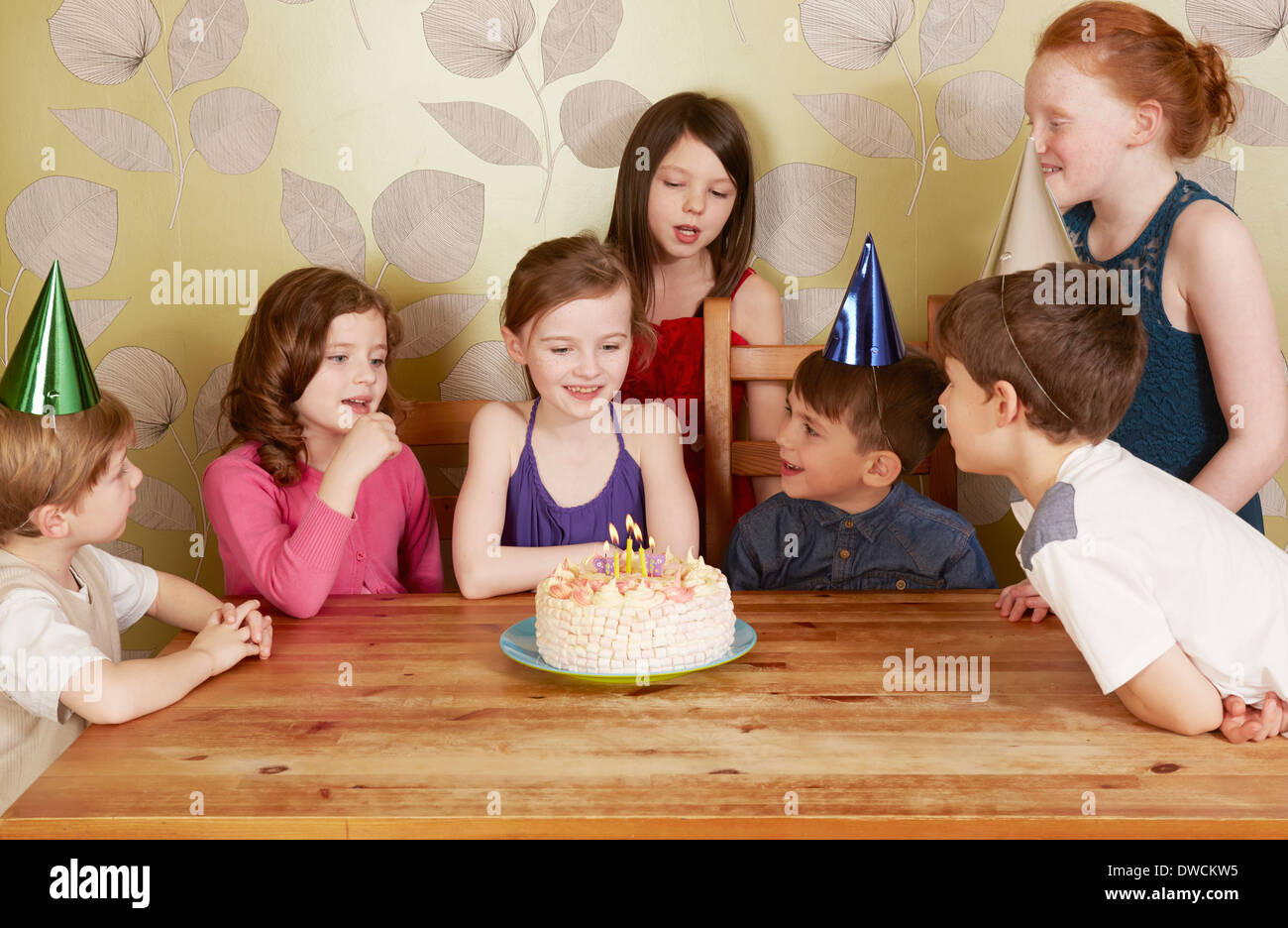 Children at birthday party, girl with cake Stock Photo