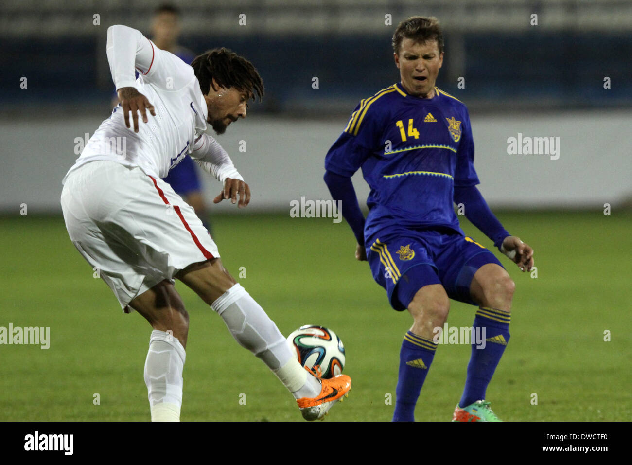 Cyprus, Larnaka- March 05,2014: Ukraine's   Ruslan Rotam fight  for the ball with USA's Jermaine Jones  during the friendly game  between Ukraine  and USA at the Antonis Papadopoulos  stadium in Larnaka on March  05,2014 Credit:  Yiannis Kourtoglou/Alamy Live News Stock Photo