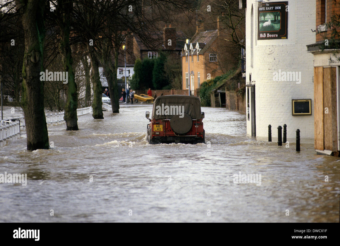 A landrover driven through the flooded River Severn on Wharfage in Ironbridge 1993 Stock Photo