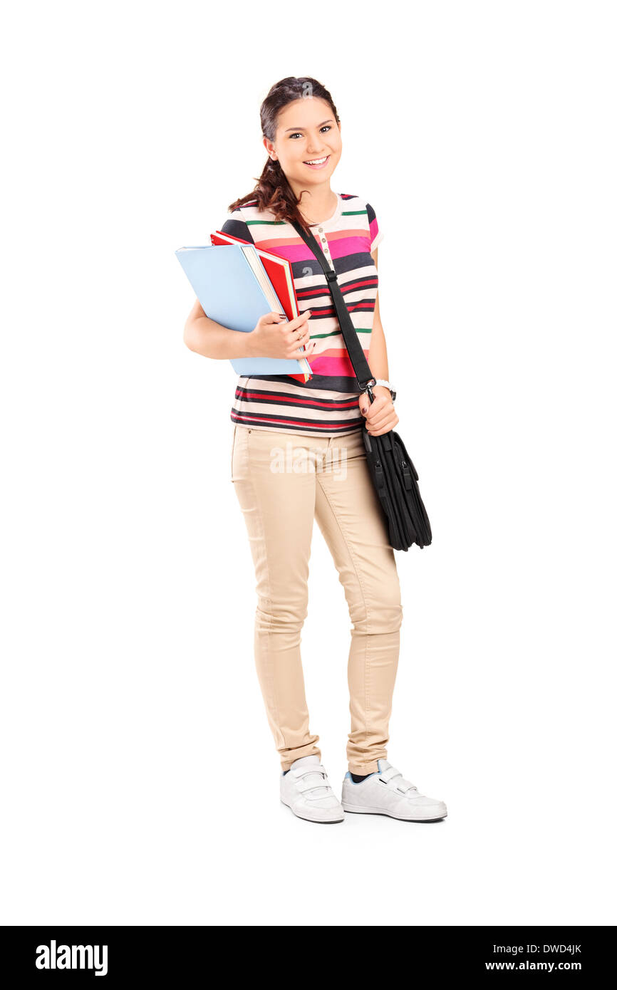 Full length portrait of a schoolgirl holding notebooks Stock Photo - Alamy