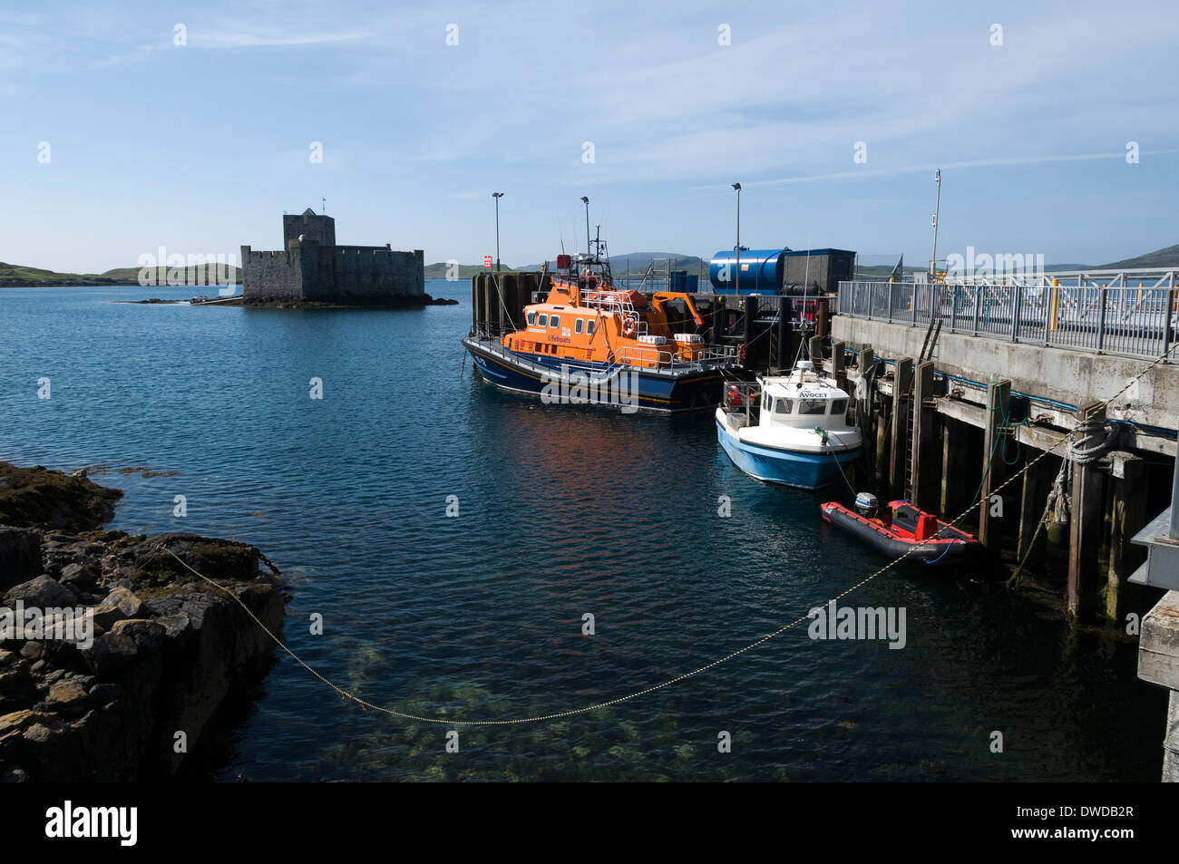 Kisimul Castle and the lifeboat from the harbour, Castlebay, Isle of Barra, Western Isles, Scotland. Stock Photo