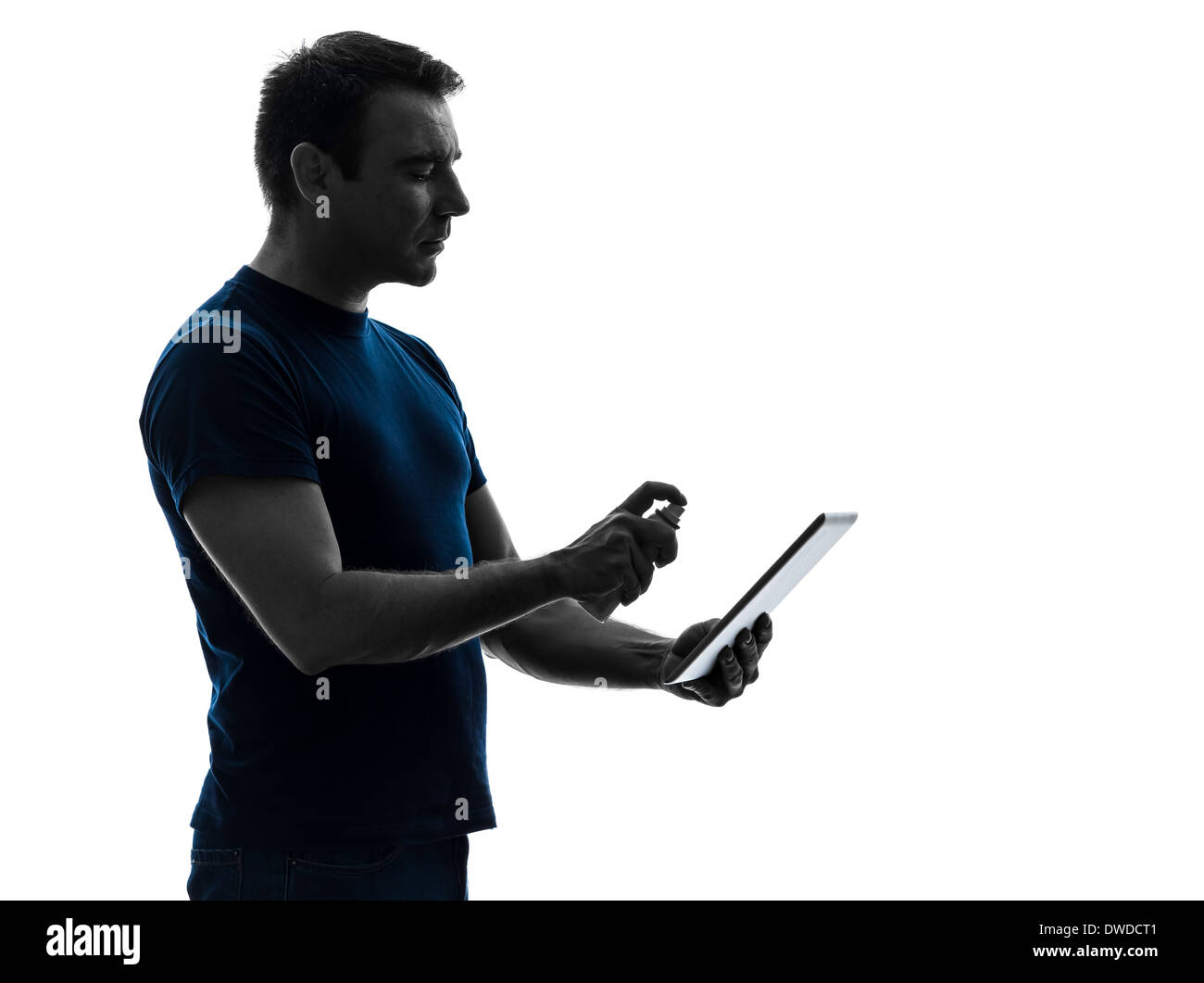 one man cleaning dusting digital tablet in silhouette on white background Stock Photo