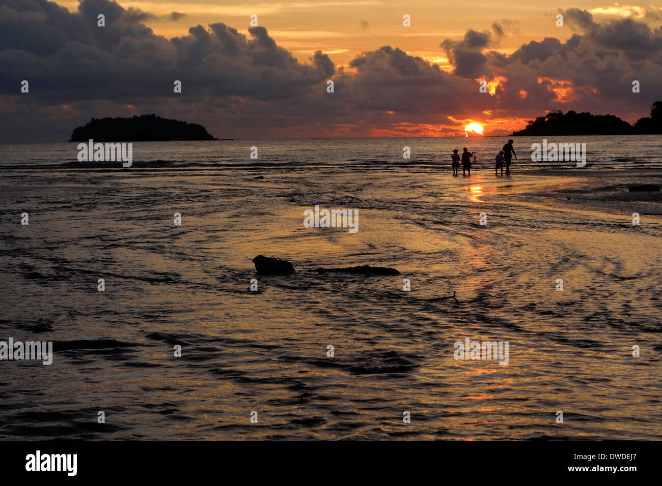 Family on Klong Prao Beach at sunset, Koh Chang Island, Thailand. Stock Photo