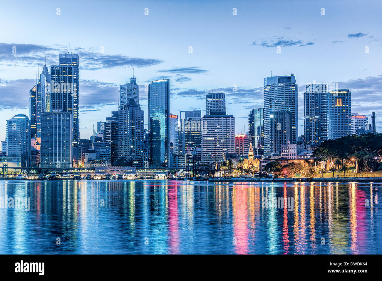 The city lights of Sydney reflect on the water in the Harbor NSW