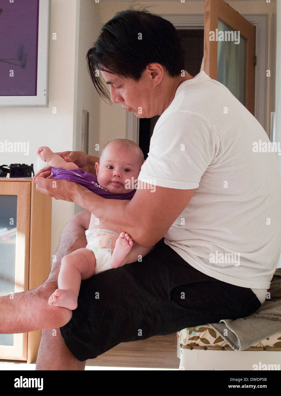 father taking care of baby
