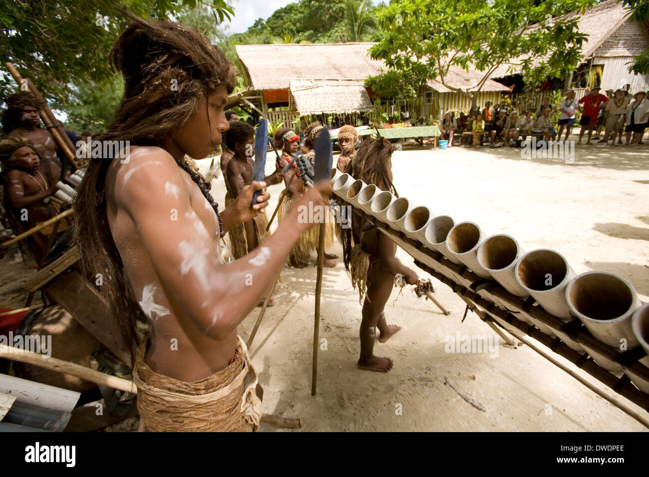 Young men perform on homemade plastic musical instruments at Nggela Island, Solomon Islands, South Pacific Stock Photo
