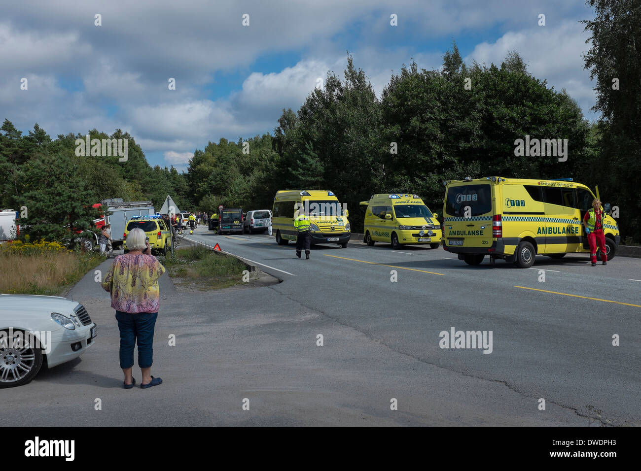 Minutes after the ambulance crew have arrived at a road accident scene in Norway. Stock Photo