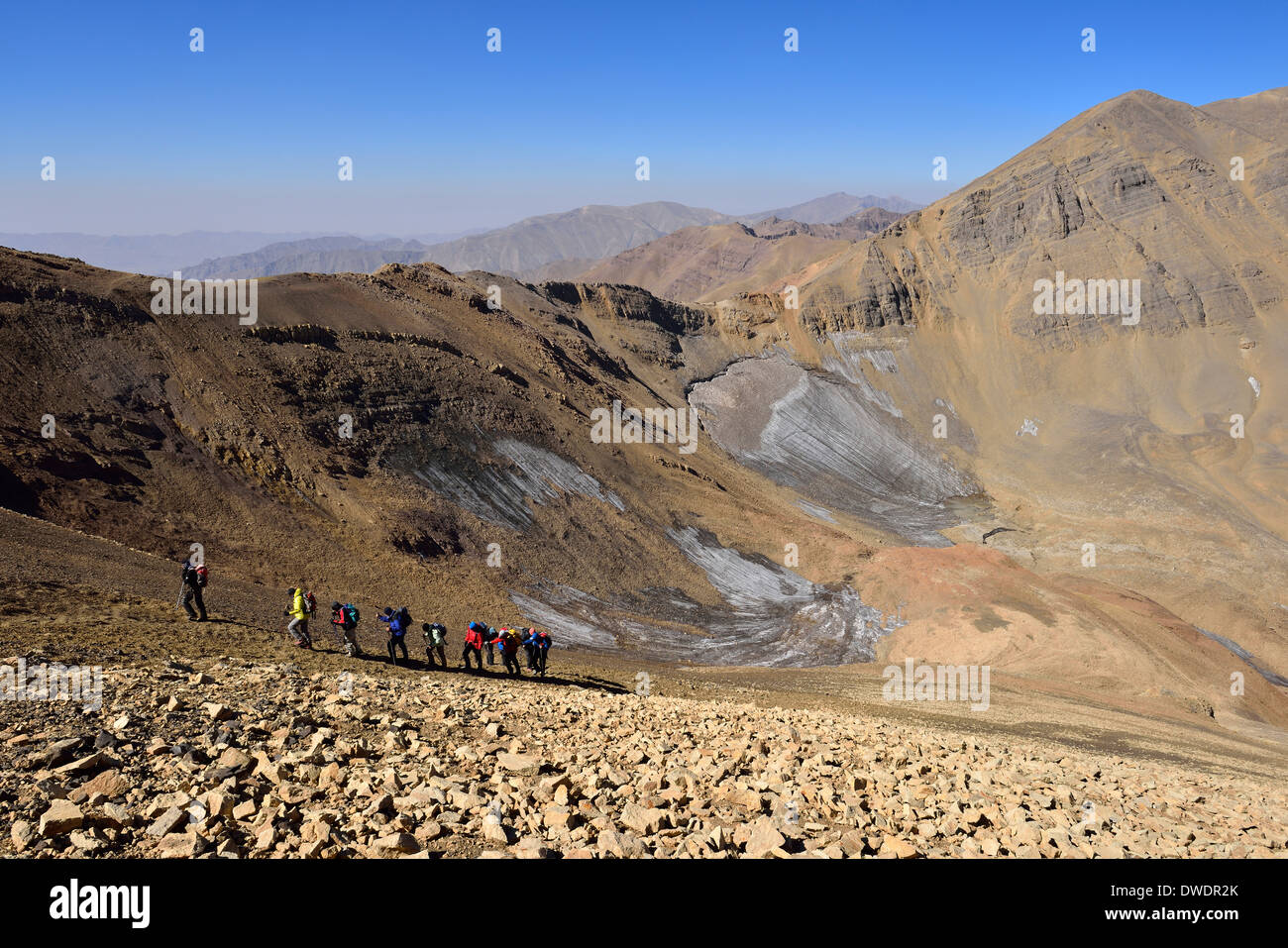 Iran Mazandaran Province Alborz mountains Takht-e Suleyman Massif Alam Kuh area group of people hiking up mount Lashgarak Stock Photo