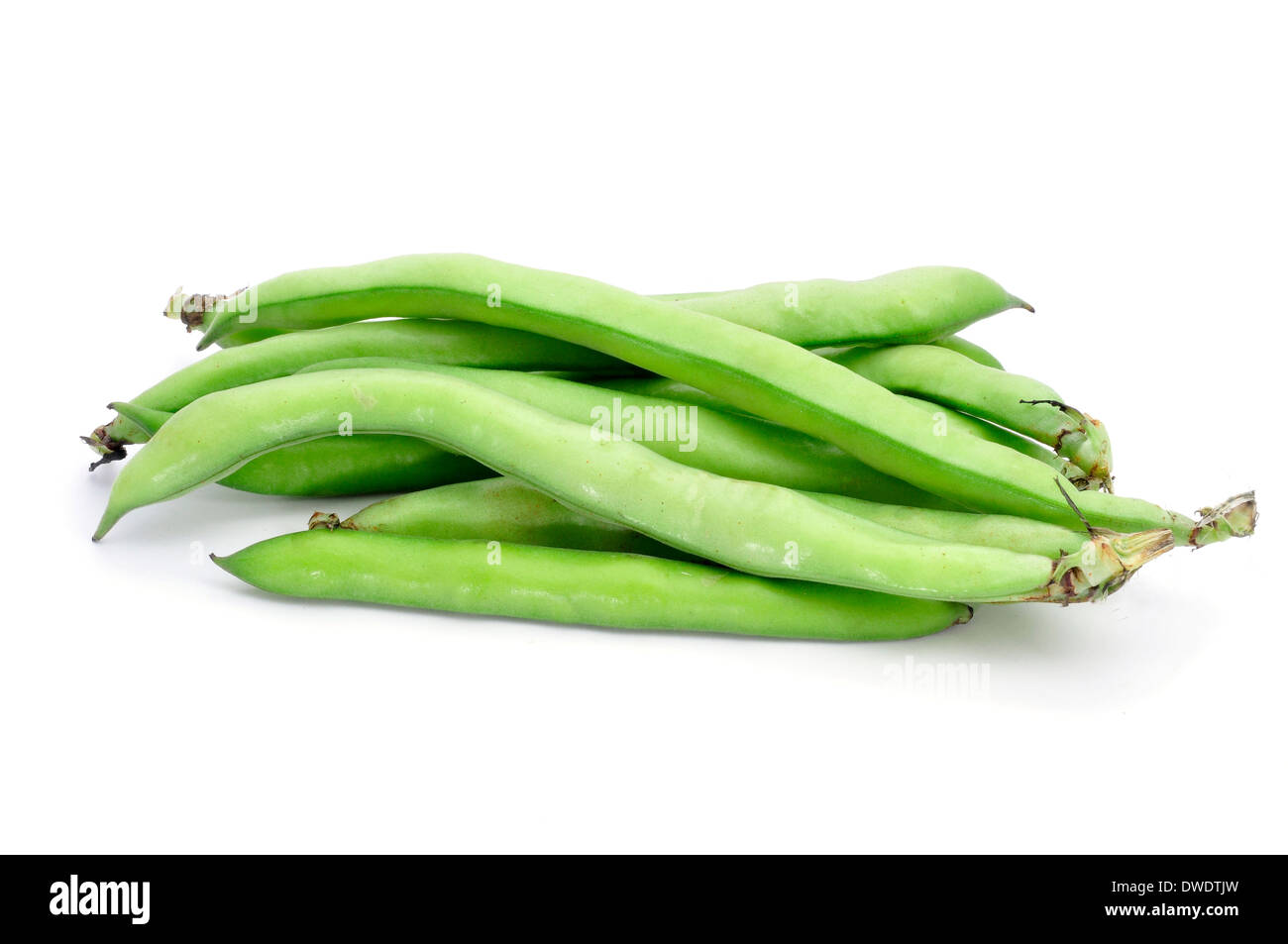 a pile of broad bean pods on a white background Stock Photo