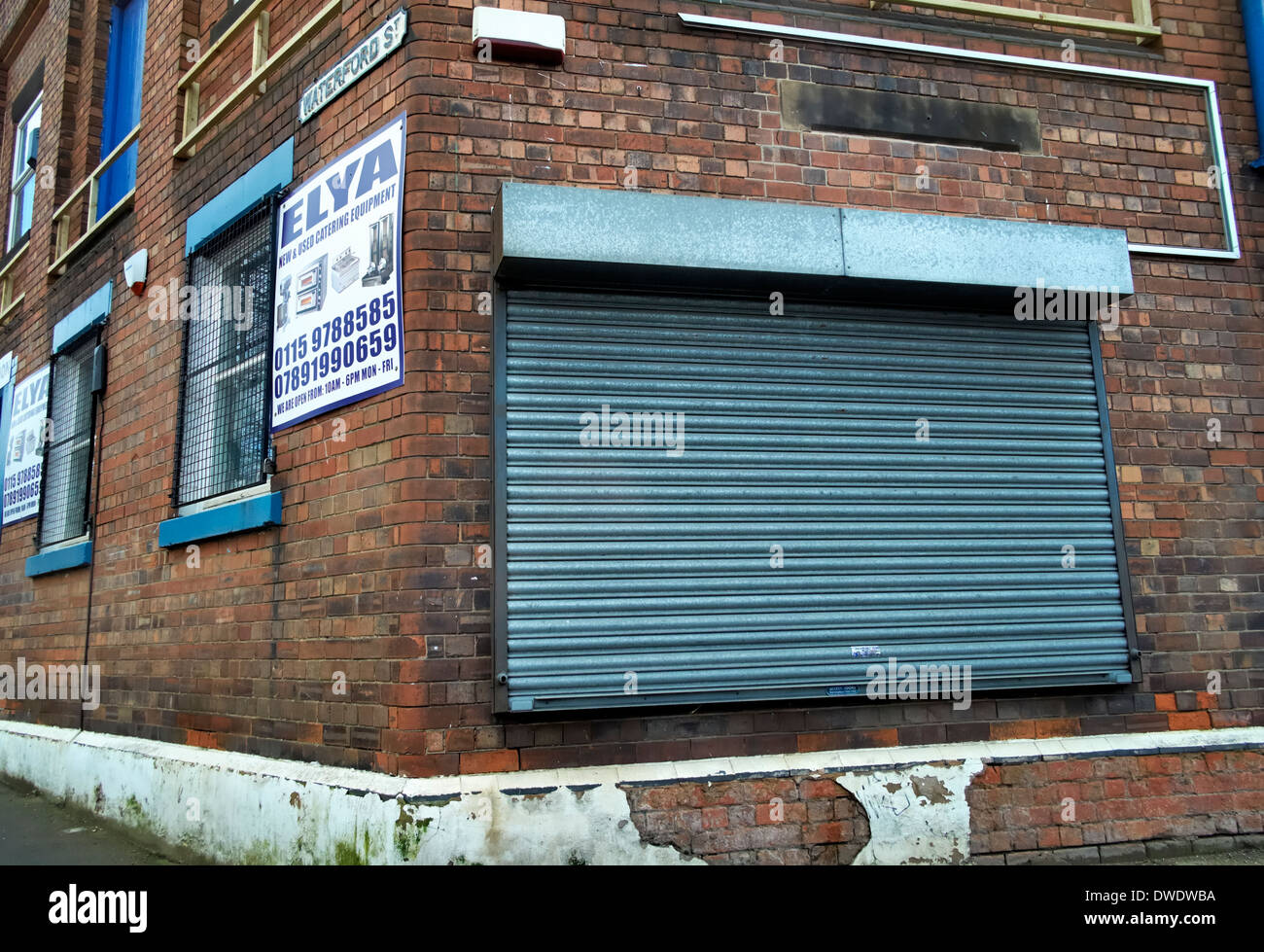 Metal shutter on the side of a building Nottingham England uk Stock Photo