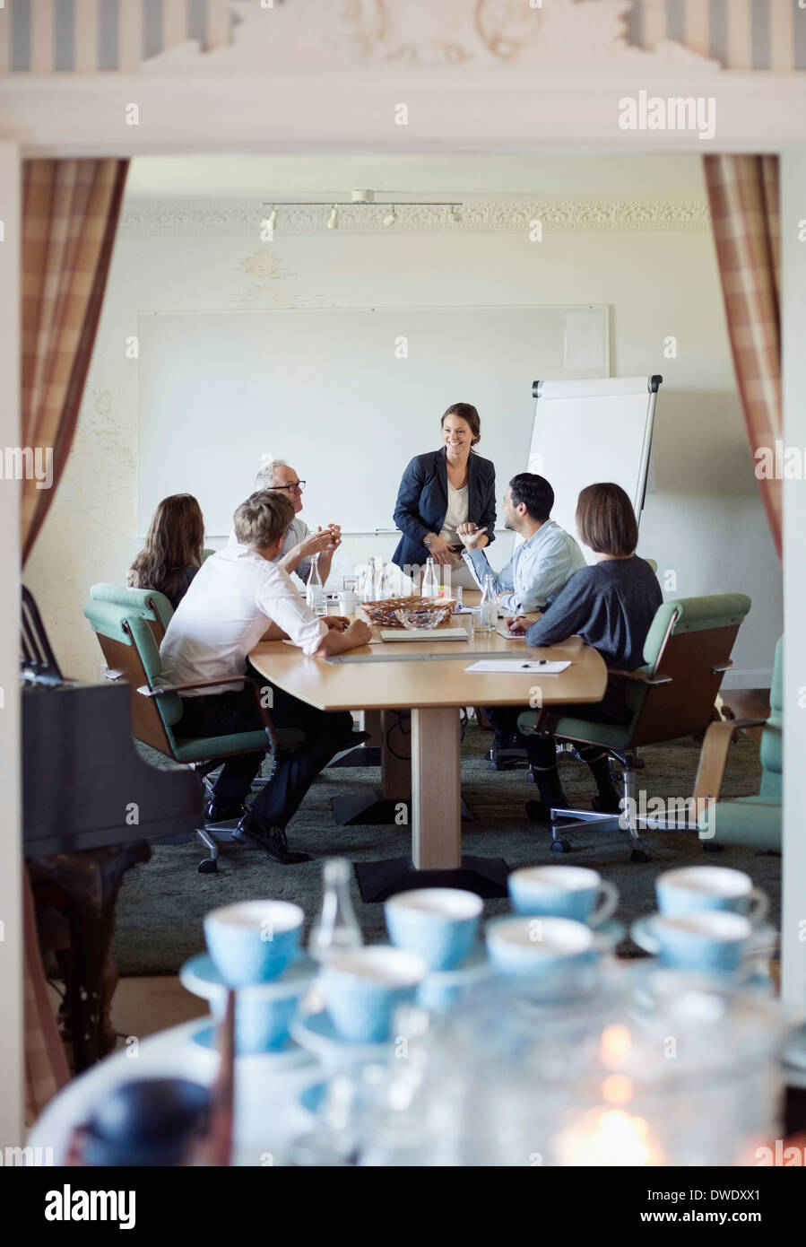 View of business people in conference meeting through doorway Stock Photo