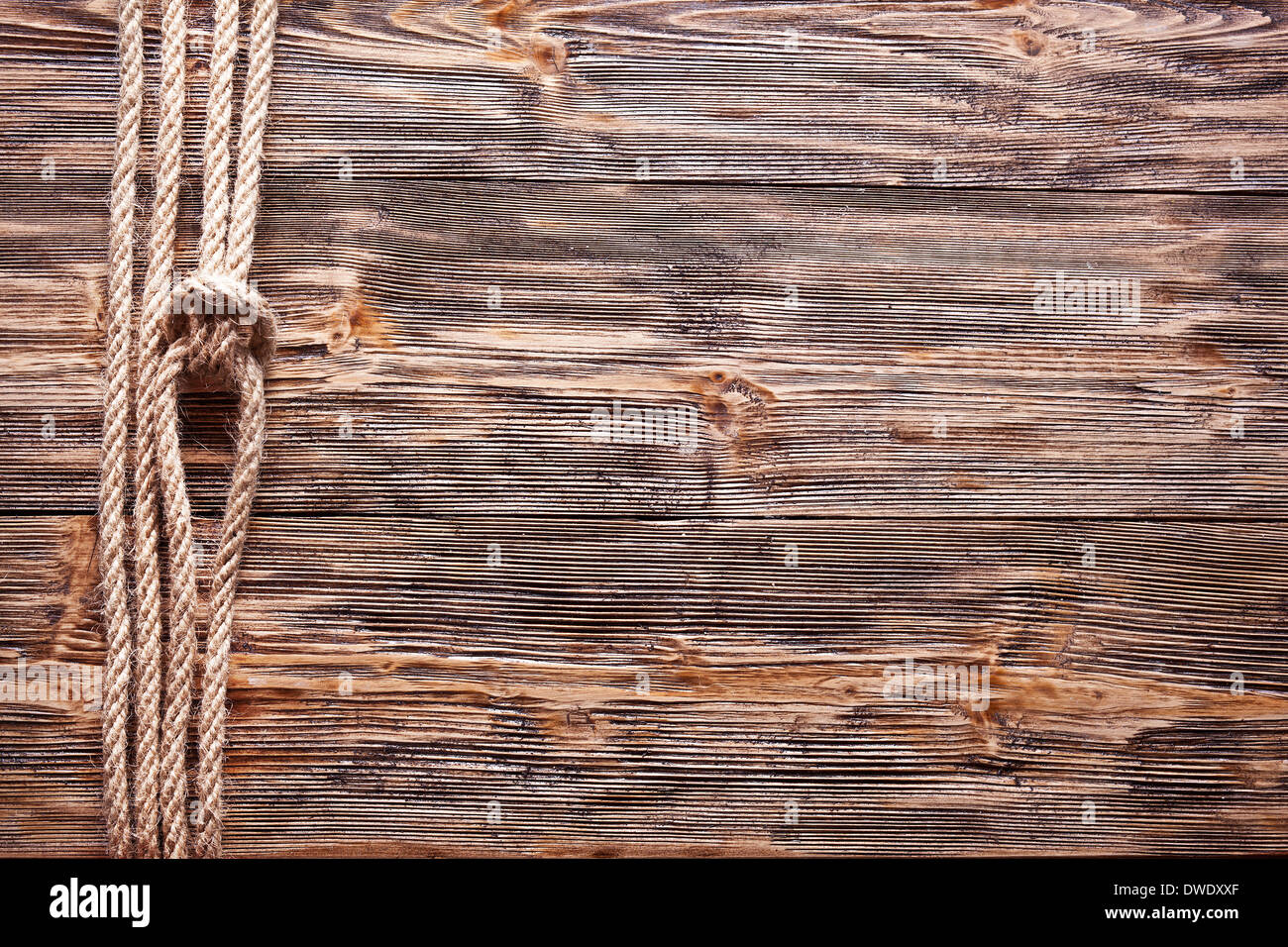 Sailor's knot over old wooden background. Stock Photo