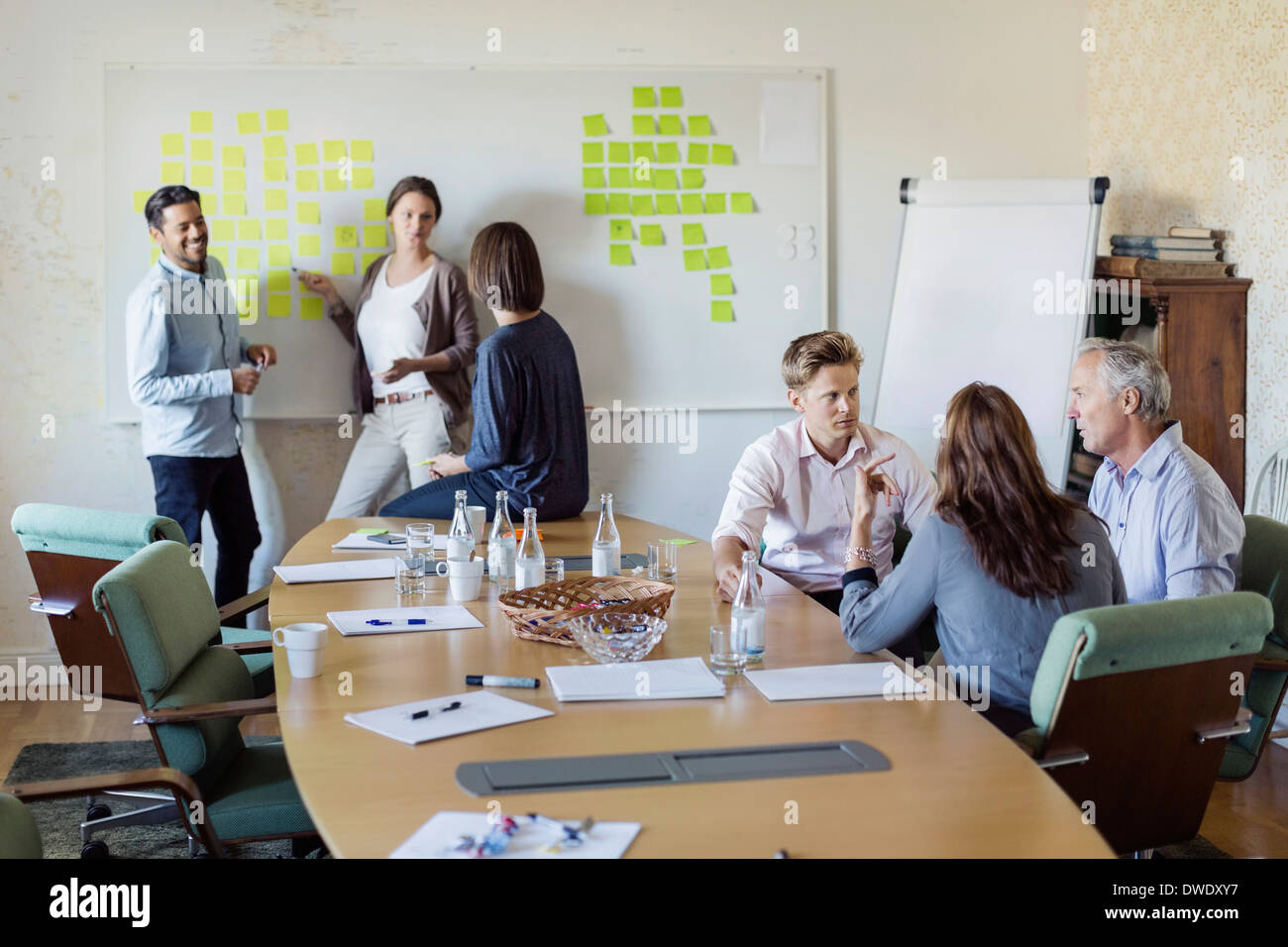 Group of business people discussing in board room Stock Photo