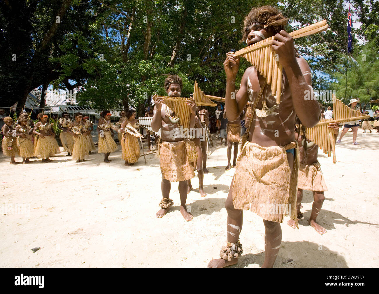 Boys perform on handmade bamboo mouth harps at Nggela Island, Solomon Islands, South Pacific Stock Photo