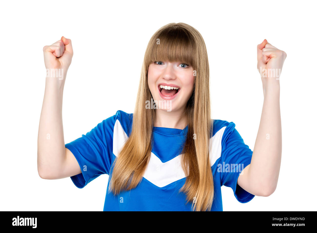 Happy girl in blue soccer shirt is holding her fists up Stock Photo