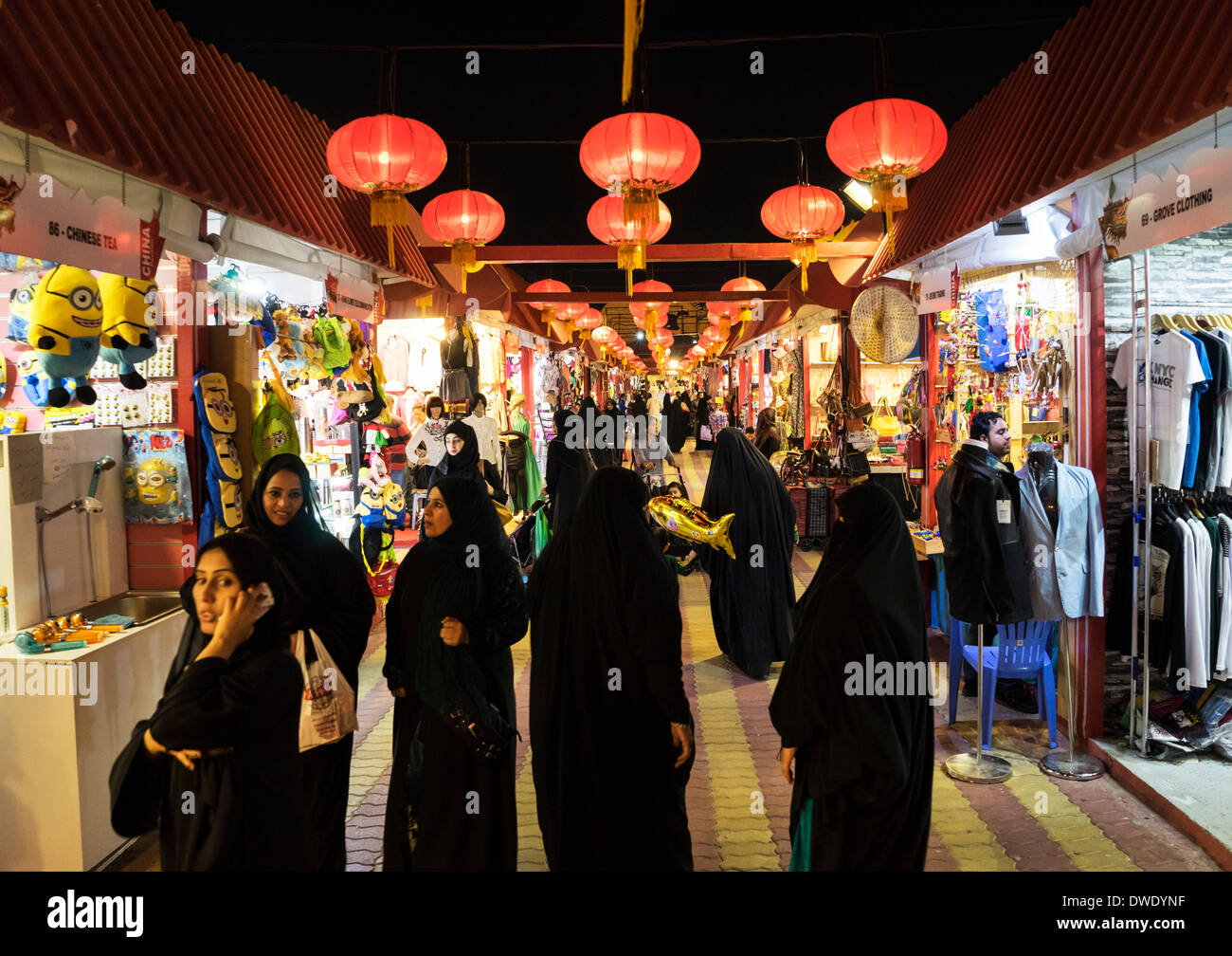 Women shopping in arcade at China Pavilion at Global Village tourist cultural attraction in Dubai United Arab Emirates Stock Photo
