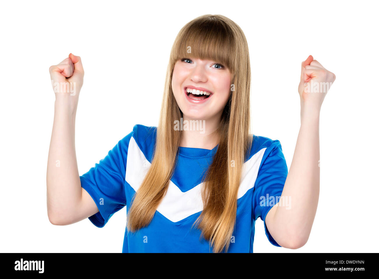 Happy girl in blue soccer shirt is holding her fists up Stock Photo