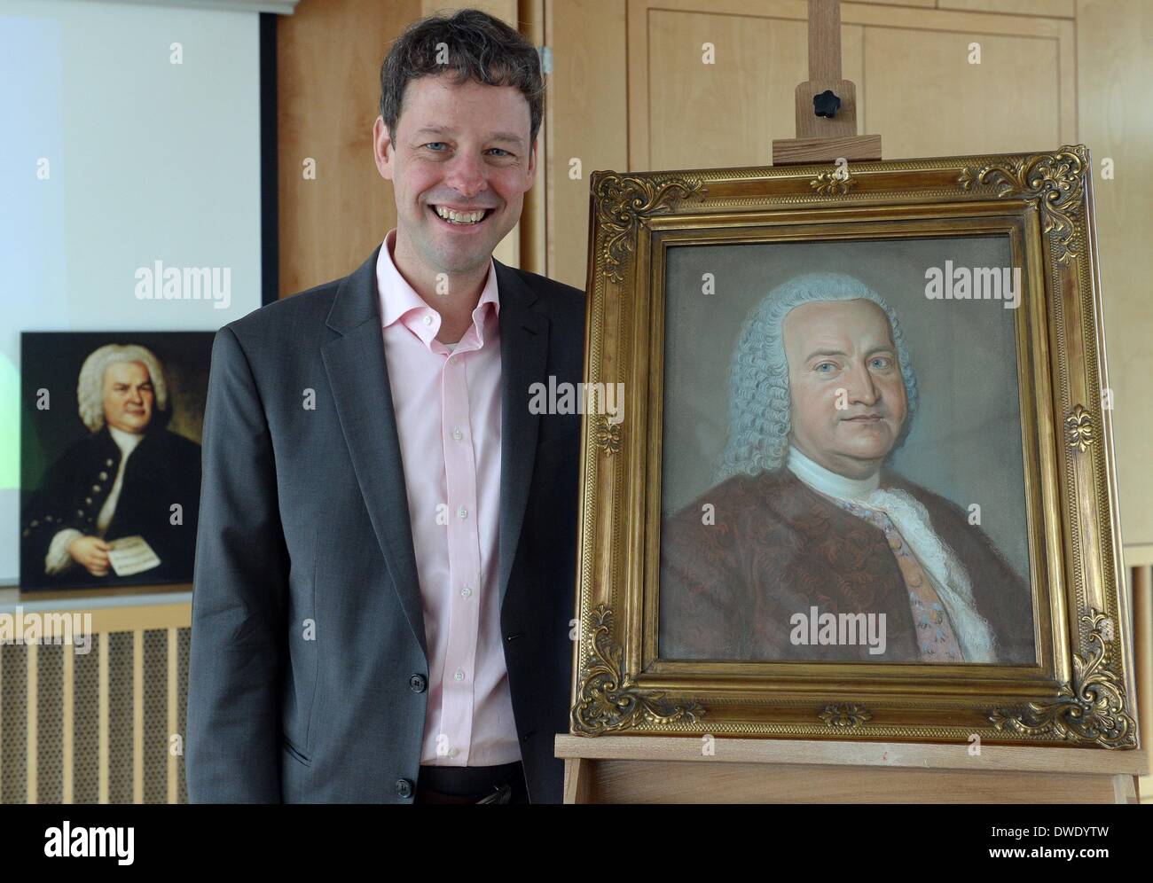 Berlin, Germany. 06th Mar, 2014. Joerg Hansen, Director of the Bachhaus Eisenach, stands next to a likely authentic portrait of Johann Sebastian Bach in Berlin, Germany, 06 March 2014. The Bachhaus Eisenach acquired the pastel picture as it is thought to be the lost Bach portrait from the collection of his son Carl Philipp Emanuel in the background is a print of the Bach portrait by painter Elias Gottlob Haumann. Photo: Britta Pedersen/dpa/Alamy Live News Stock Photo