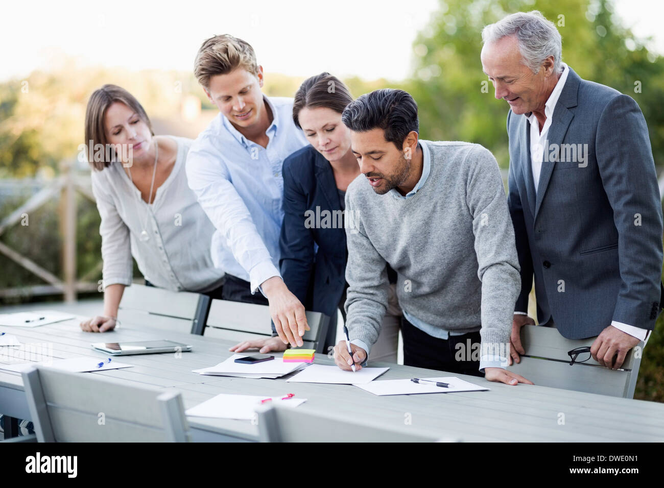 Business people discussing on patio Stock Photo