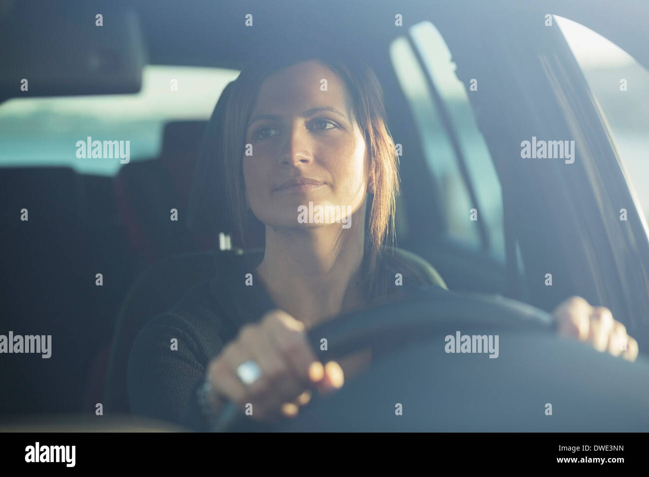 Young businesswoman driving car Stock Photo - Alamy