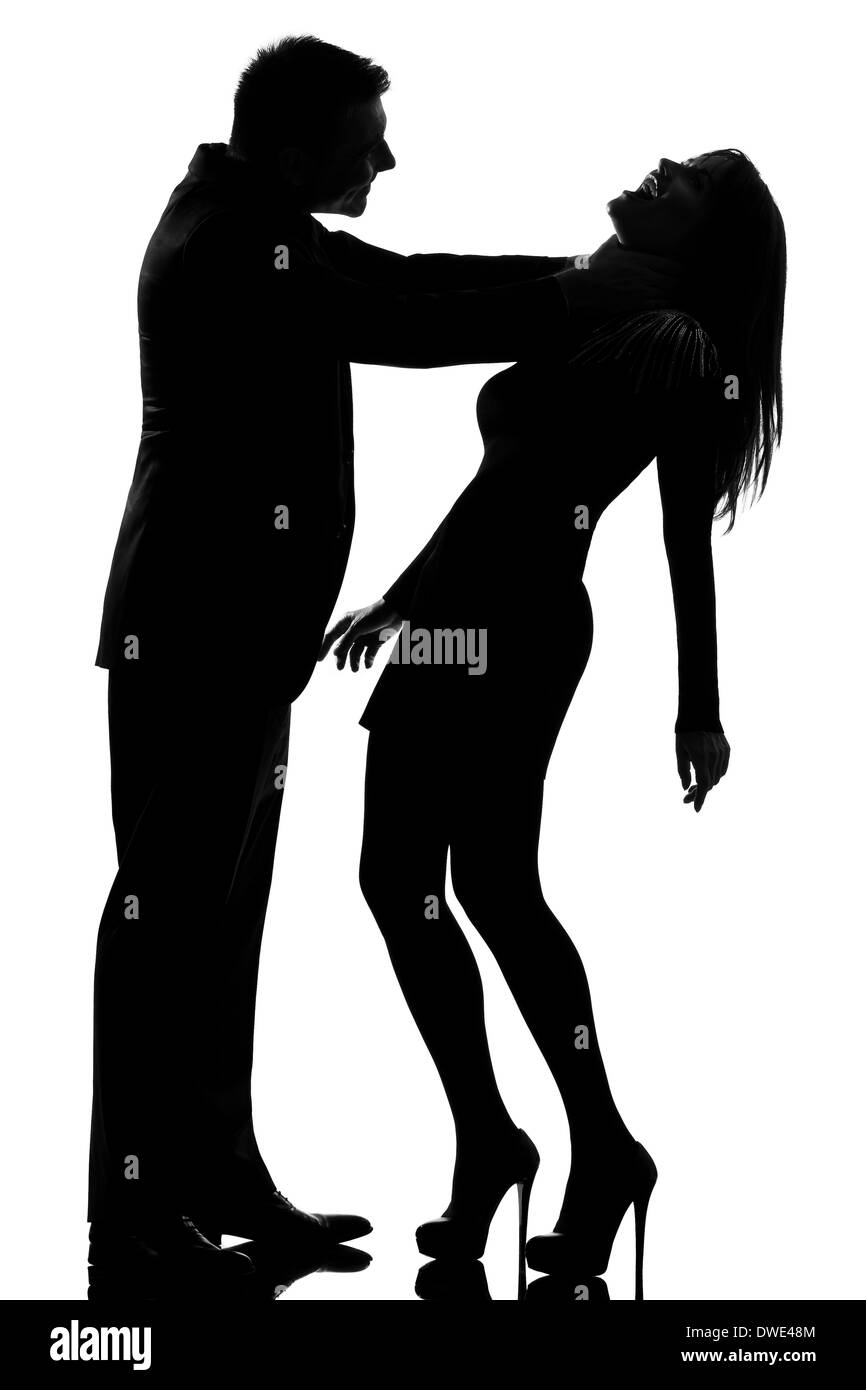 one caucasian couple man strangulate woman expressing domestic violence in studio silhouette isolated on white background Stock Photo
