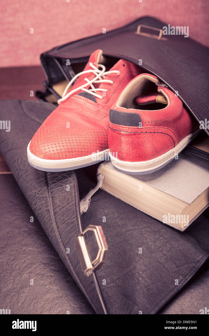 Close up shut of a pair sneakers in a briefcase Stock Photo