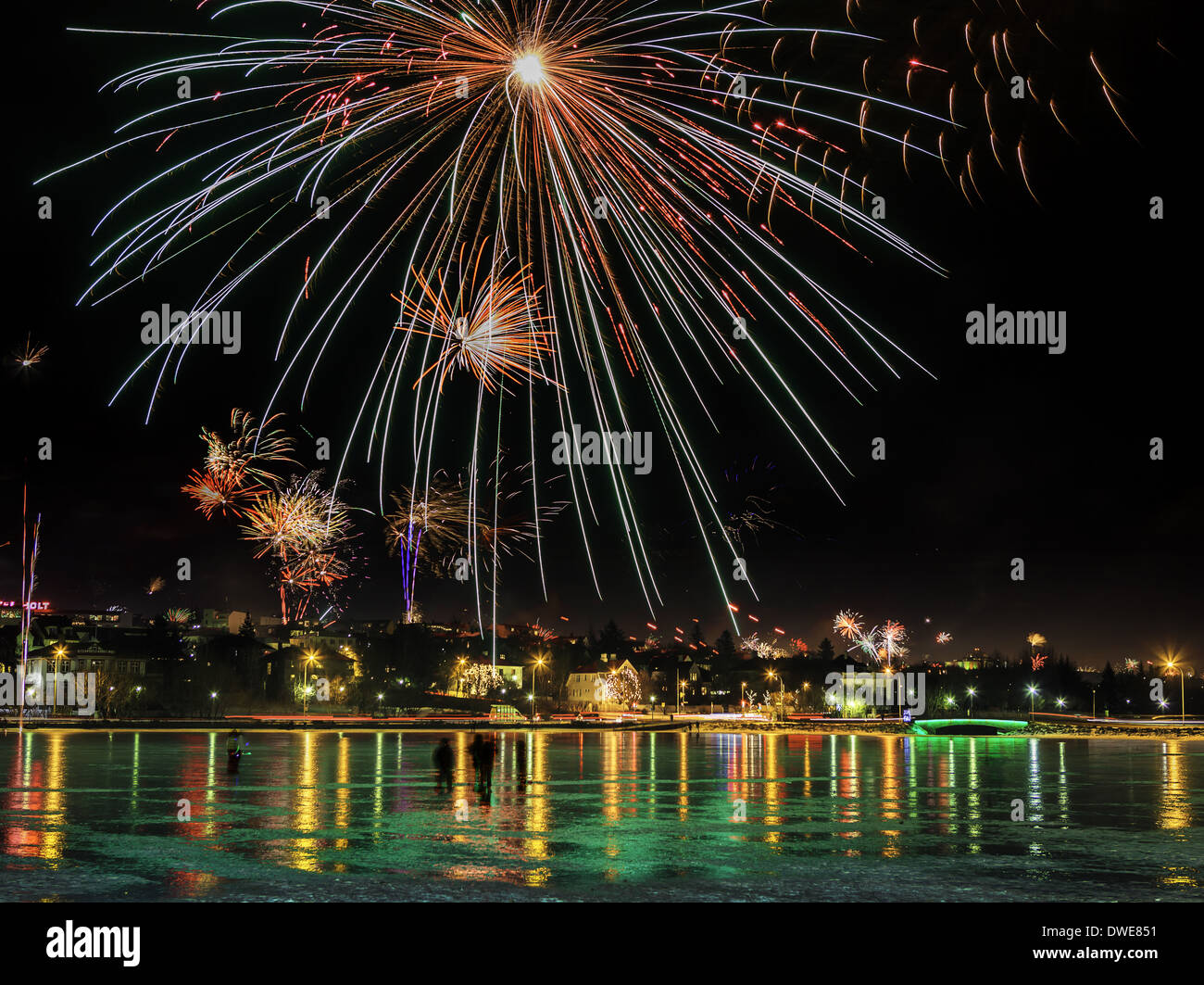 Fireworks over the pond in Reykjavik, New Years' Eve, Iceland Stock Photo